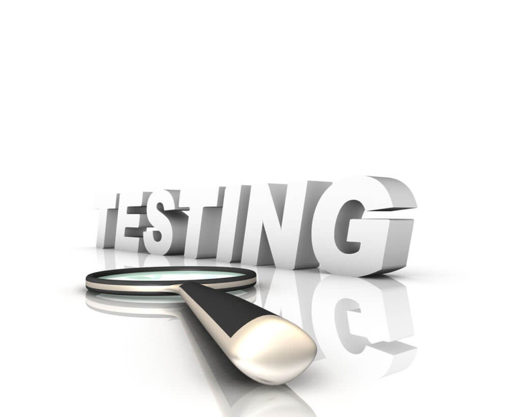 The word "Testing" with a magnifying glass