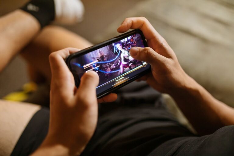 A person playing a mobile game on a smartphone