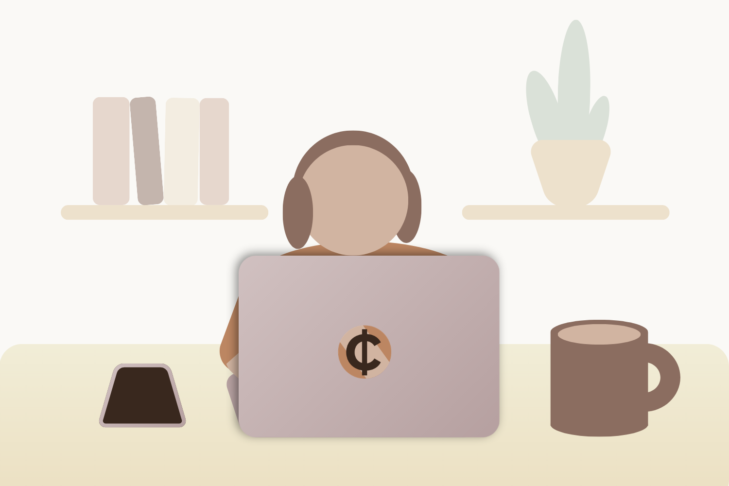 A person wearing headphones and using a laptop on a table with a smartphone and a cup of coffee